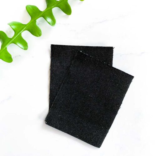 Zwarte jeans reparatiepatch