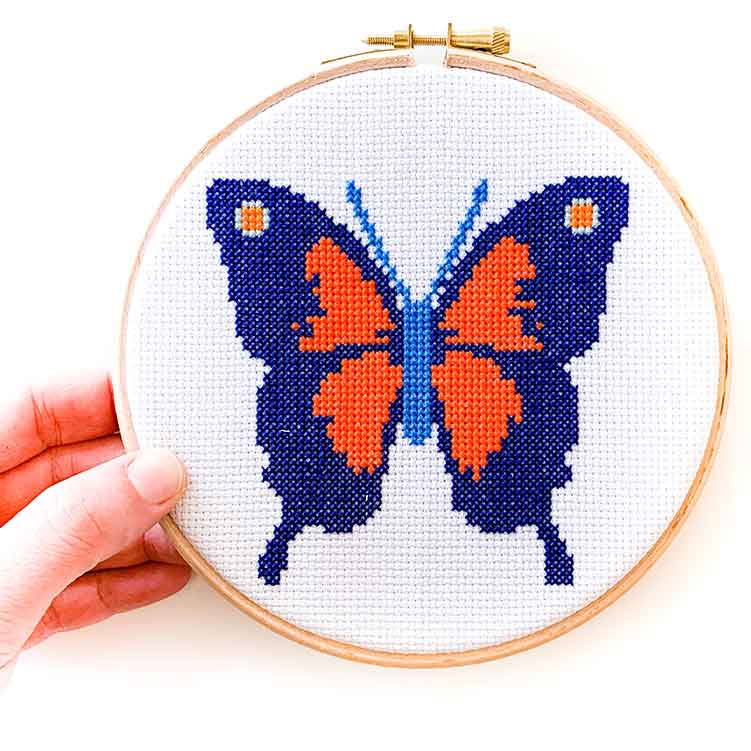 Rood blauw vlinder kruissteek pakket