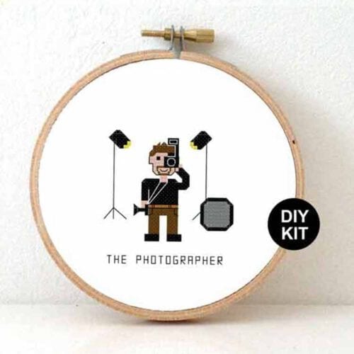 man fotograaf kruissteek borduurpakket