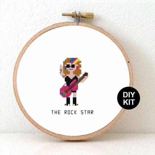 vrouw gitarist rockster kruissteek patroon