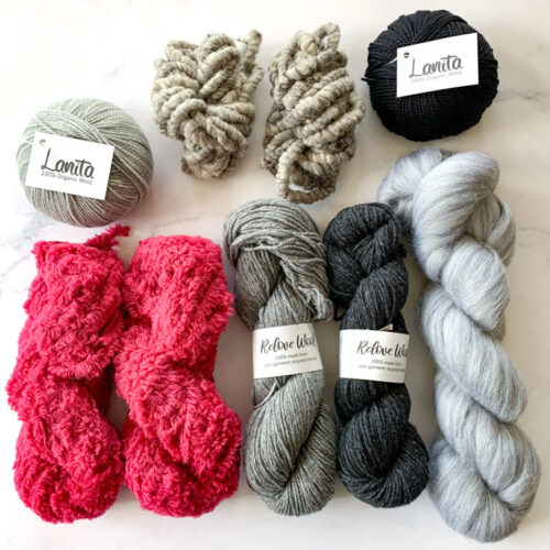 large pink and gray weaving yarn pack