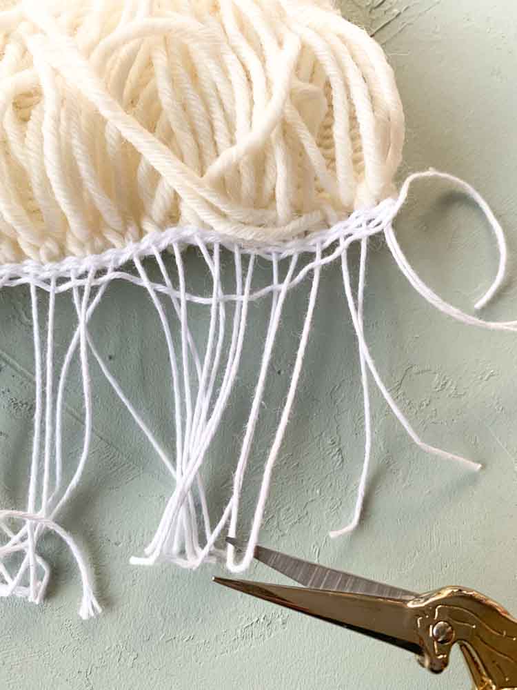 hoe haal je je weefproject van het weefraam hoe haal je je weefproject van het weefraam