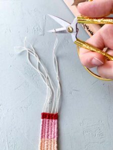 how to weave a bracelet taking it from the loom braiding